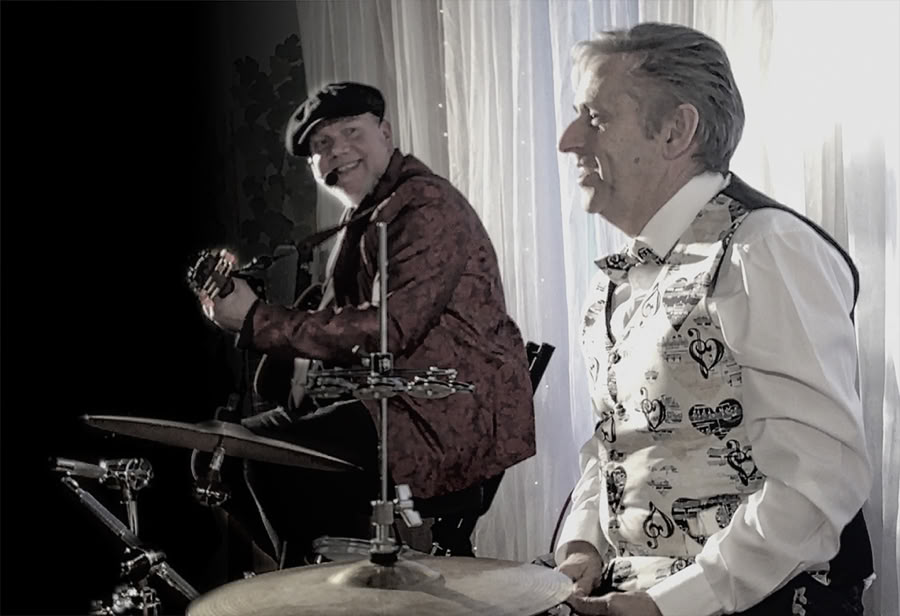 Rock Swings on Stage  Ginger grins at the Drummer Mike Heathcote